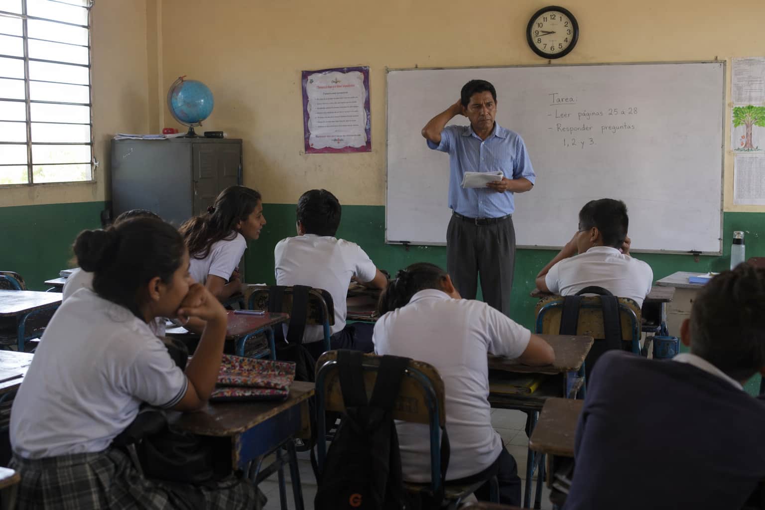 Students who have finished their work sitting restlessly while the teacher stands at the front with time remaining
